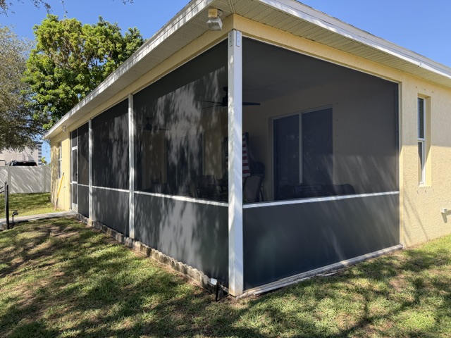 Screened corner patio with white framing