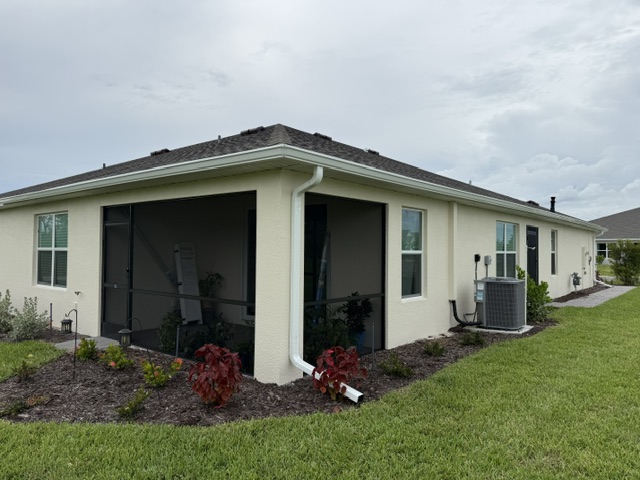 Screened lanai beside garden beds